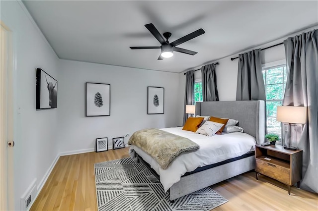 bedroom featuring wood-type flooring and ceiling fan