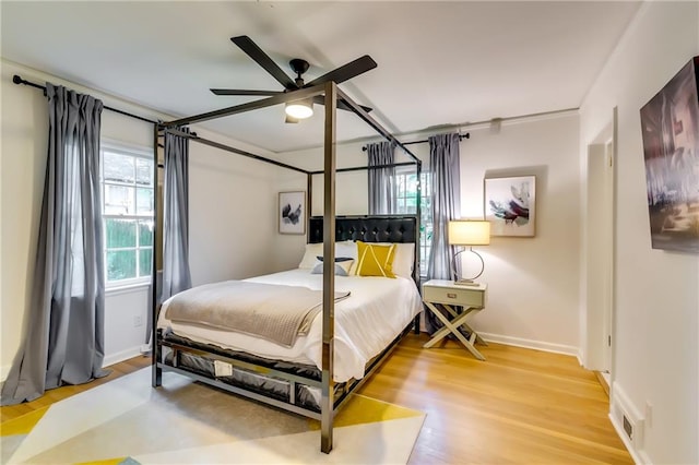 bedroom featuring hardwood / wood-style flooring and ceiling fan