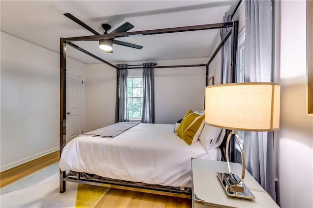 bedroom featuring ceiling fan and wood-type flooring