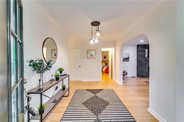 foyer entrance with light hardwood / wood-style flooring