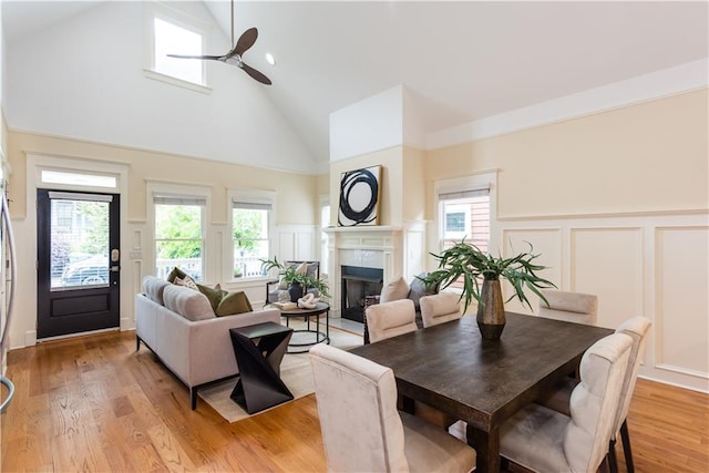 151 Savannah St SE, Atlanta, GA 30316 - dining area featuring a decorative wall, high vaulted ceiling, a fireplace, ceiling fan, and wainscoting