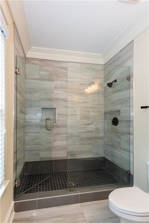 151 Savannah St SE, Atlanta, GA 30316 - full bathroom featuring ornamental molding, toilet, a stall shower, and plenty of natural light