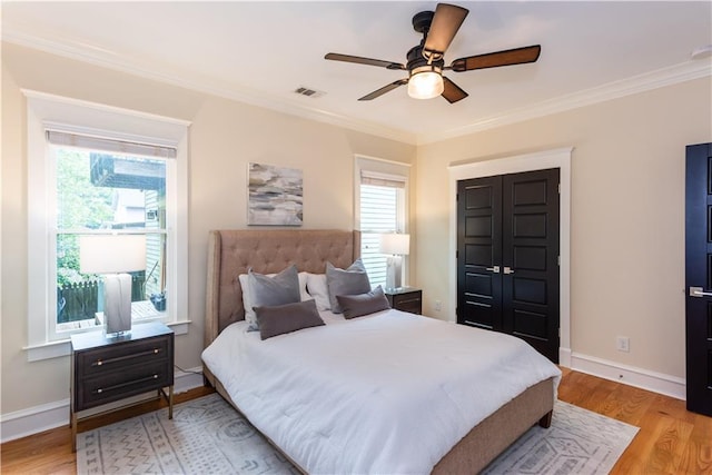 151 Savannah St SE, Atlanta, GA 30316 - bedroom featuring multiple windows, crown molding, light wood finished floors, and baseboards