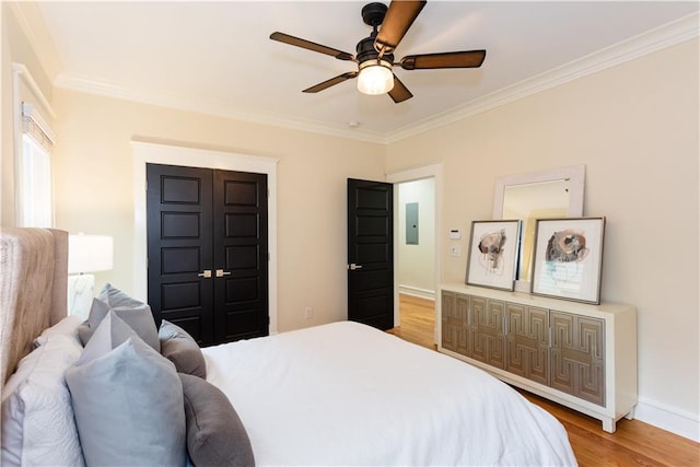 151 Savannah St SE, Atlanta, GA 30316 - bedroom featuring crown molding, light wood-style floors, electric panel, ceiling fan, and baseboards