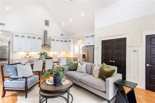 151 Savannah St SE, Atlanta, GA 30316 - living area with high vaulted ceiling, light wood finished floors, and recessed lighting