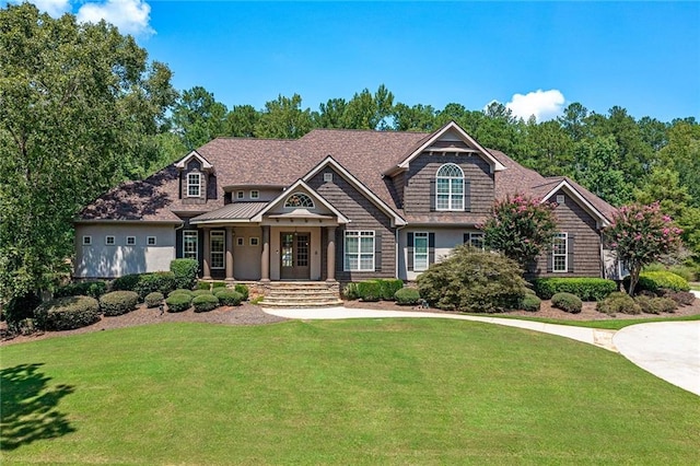 craftsman-style house with a front lawn