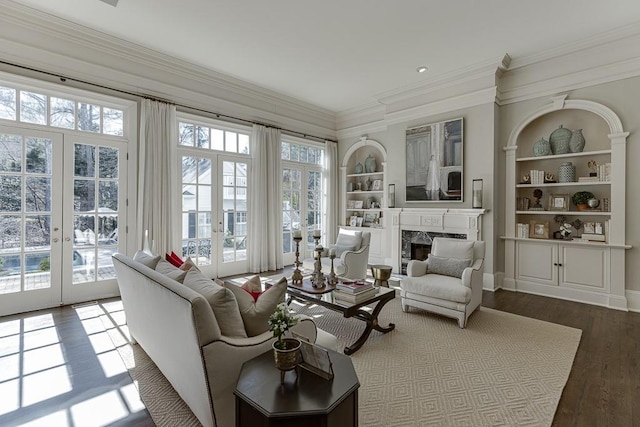 sunroom / solarium with french doors, plenty of natural light, and a premium fireplace