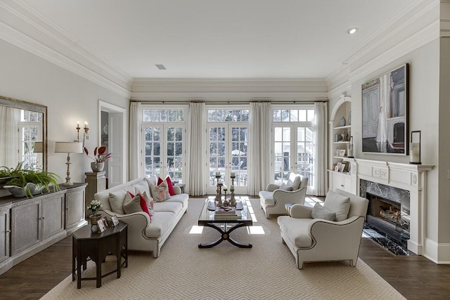 sunroom / solarium featuring a healthy amount of sunlight, a premium fireplace, and visible vents