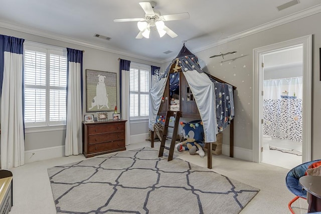 interior space with a wealth of natural light, visible vents, crown molding, and carpet flooring