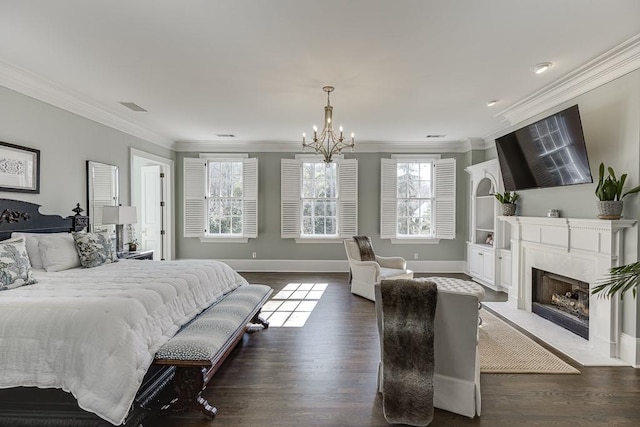 bedroom featuring a premium fireplace, baseboards, dark wood finished floors, and ornamental molding