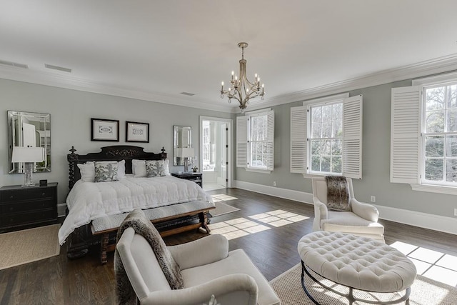 bedroom with visible vents, crown molding, baseboards, and wood finished floors