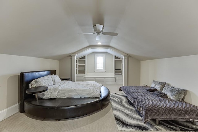 bedroom with carpet, vaulted ceiling, baseboards, and ceiling fan