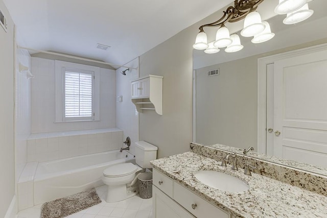 bathroom with visible vents, toilet, tile patterned flooring, vanity, and washtub / shower combination