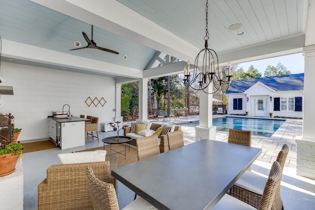 dining space featuring wood ceiling, vaulted ceiling, and ceiling fan with notable chandelier