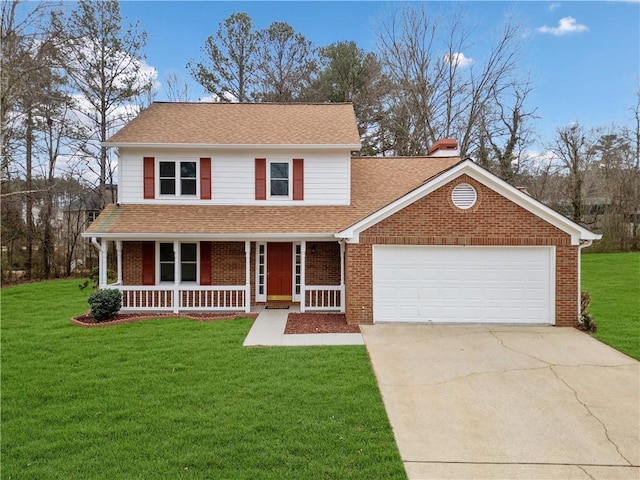 view of front of property with a garage, a front yard, and covered porch