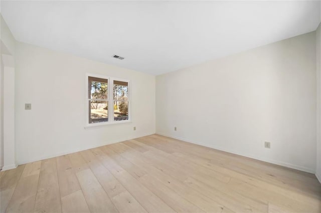 unfurnished room featuring light hardwood / wood-style flooring