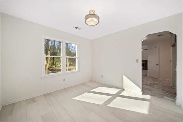 spare room with light hardwood / wood-style floors