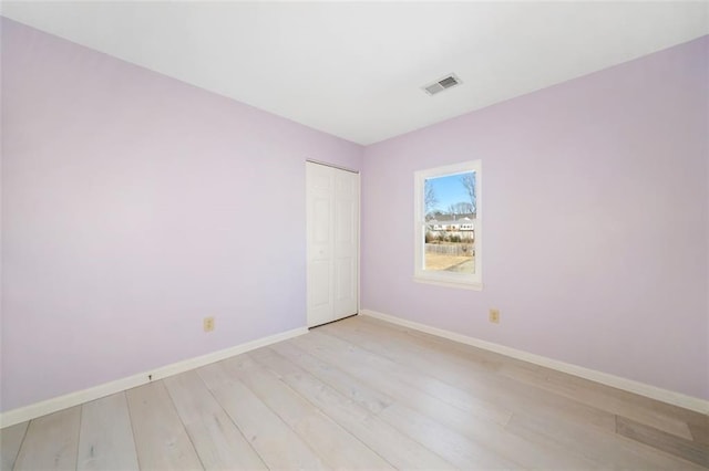 unfurnished room with light hardwood / wood-style flooring