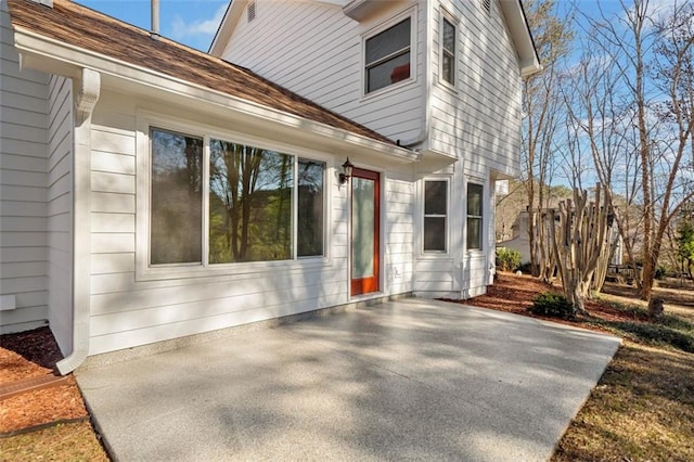 view of side of property featuring a patio