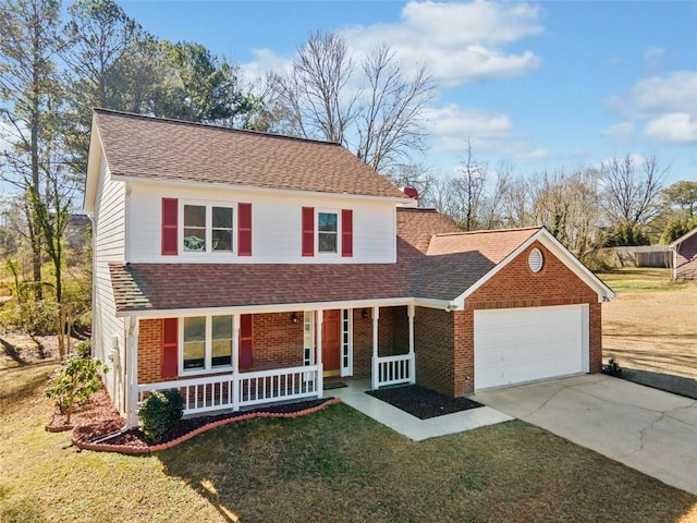 view of front of property with covered porch, a front lawn, and a garage