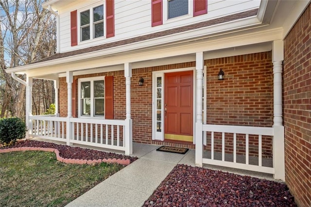 doorway to property with covered porch