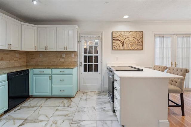 kitchen with stainless steel electric range oven, dishwasher, tasteful backsplash, a kitchen breakfast bar, and white cabinets