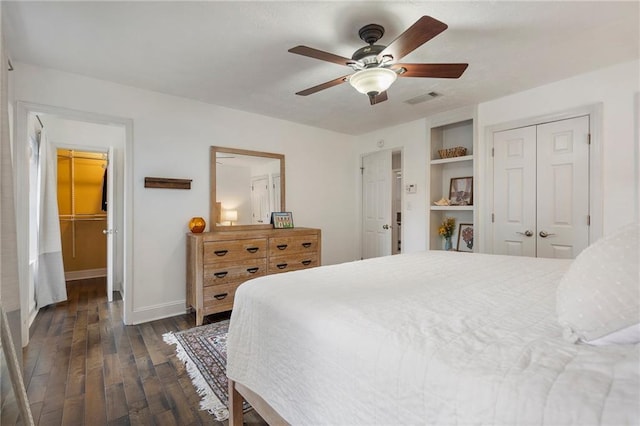 bedroom featuring ceiling fan and dark wood-type flooring