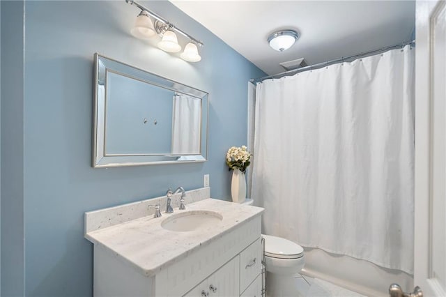 full bathroom featuring shower / bathtub combination with curtain, tile patterned flooring, vanity, and toilet