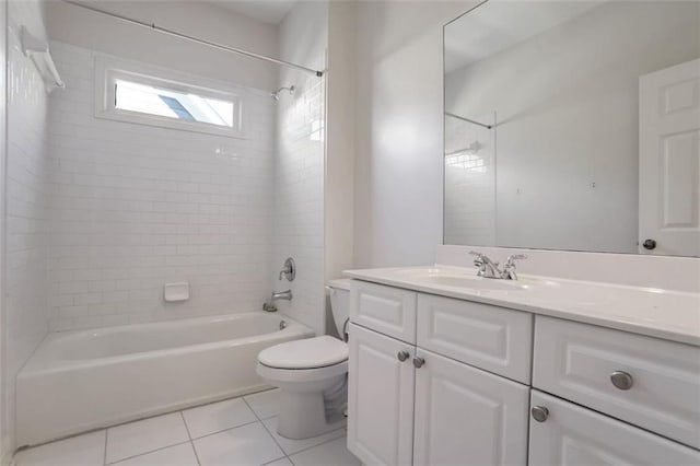 full bathroom with tile patterned floors, toilet, vanity, and tiled shower / bath