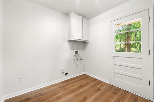 4103 Laynewood Cir, Tucker, GA 30084 - washroom with cabinet space, light wood-type flooring, and washer hookup