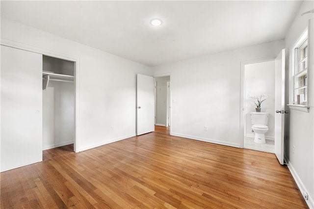 4103 Laynewood Cir, Tucker, GA 30084 - unfurnished bedroom with light wood-style flooring, a closet, and ensuite bathroom