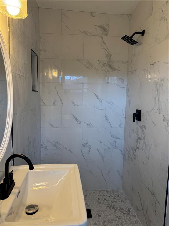4103 Laynewood Cir, Tucker, GA 30084 - bathroom with a marble finish shower, tile walls, and vanity
