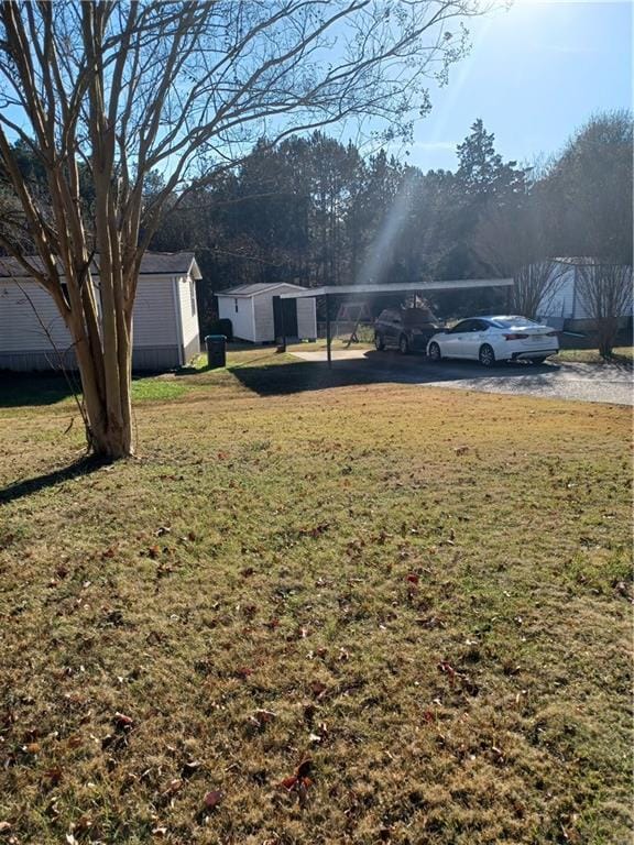 view of yard featuring a carport