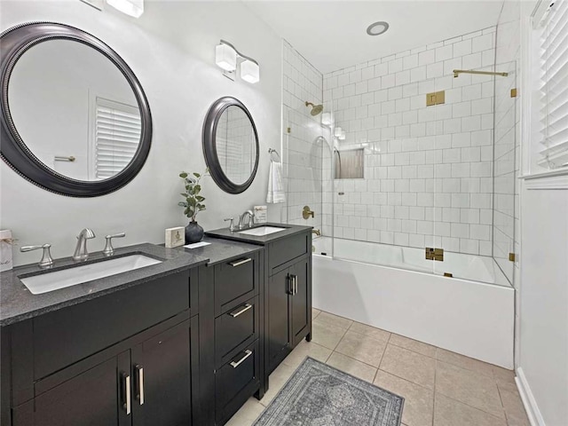 bathroom featuring a sink, tile patterned flooring, double vanity, and shower / bathing tub combination