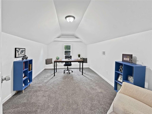 carpeted office with vaulted ceiling, baseboards, and visible vents