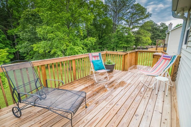 deck featuring view of scattered trees