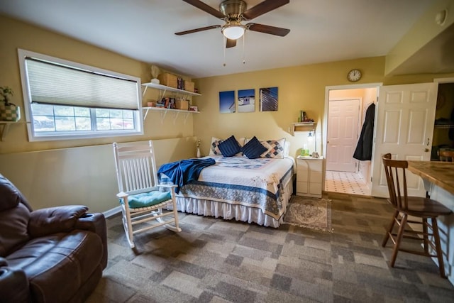 bedroom with a ceiling fan, baseboards, and carpet