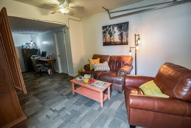 carpeted living area featuring an office area and ceiling fan