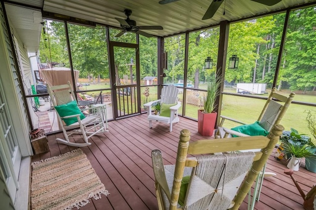 sunroom / solarium featuring ceiling fan