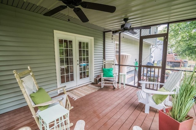sunroom featuring french doors and ceiling fan