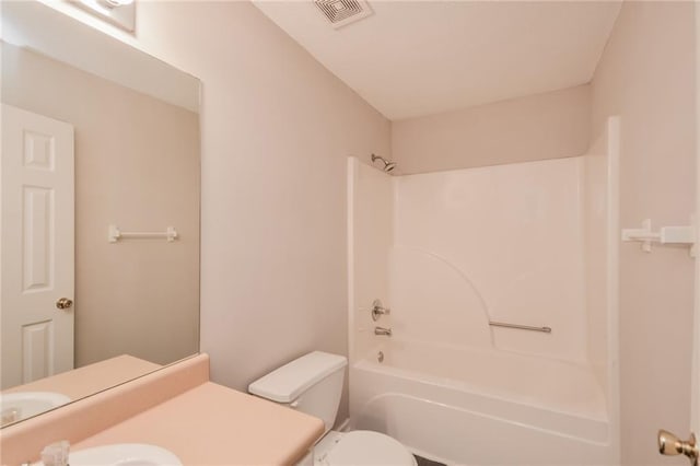 full bathroom with visible vents, bathtub / shower combination, toilet, and vanity