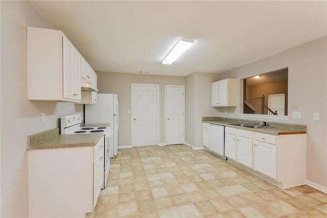 kitchen with a sink, under cabinet range hood, light countertops, white cabinets, and white appliances