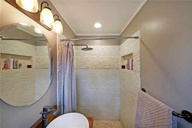 bathroom with crown molding and a tile shower