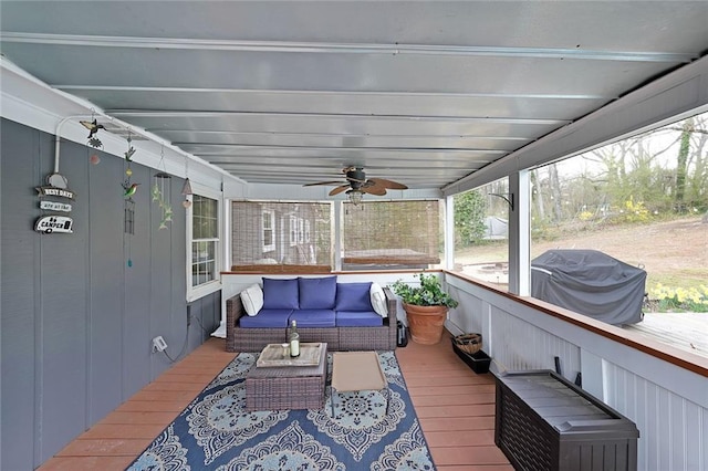 wooden deck featuring outdoor lounge area, a ceiling fan, and grilling area