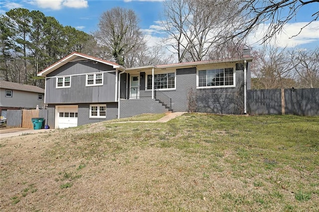 view of front facade with brick siding, an attached garage, and fence