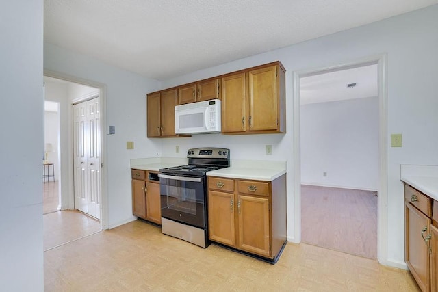 kitchen featuring stainless steel range with electric cooktop