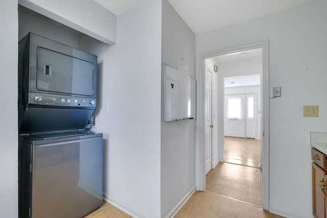 kitchen with stacked washer and dryer