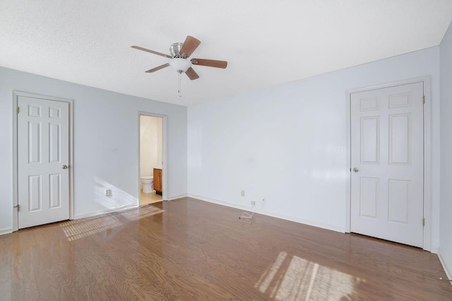 unfurnished room with hardwood / wood-style floors and ceiling fan