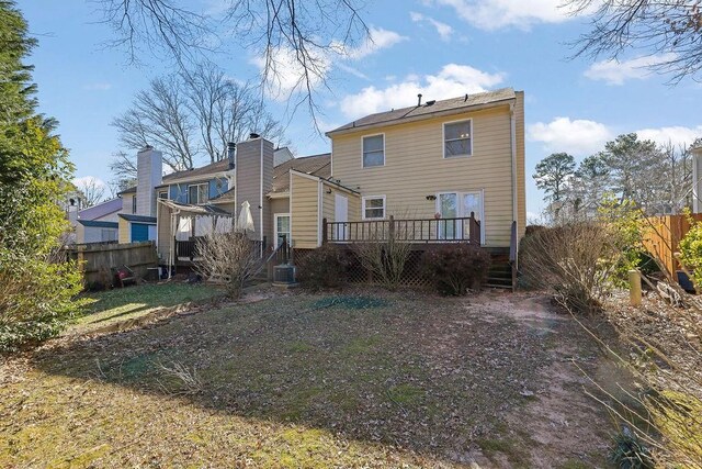 back of house with a wooden deck