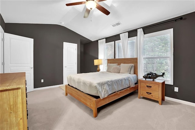 bedroom with visible vents, baseboards, ceiling fan, light carpet, and lofted ceiling